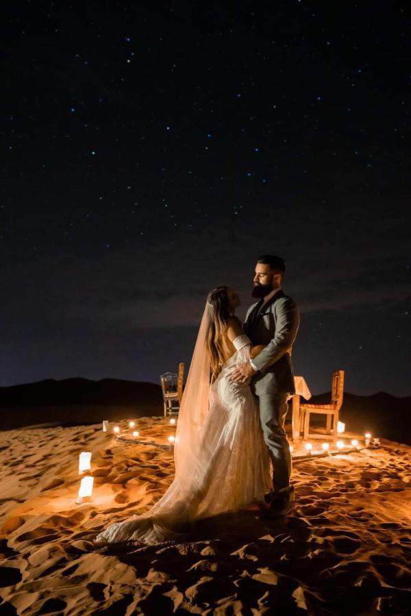 Sahara Majestic Luxury Camp Hotel Merzouga Exterior photo A couple in the desert