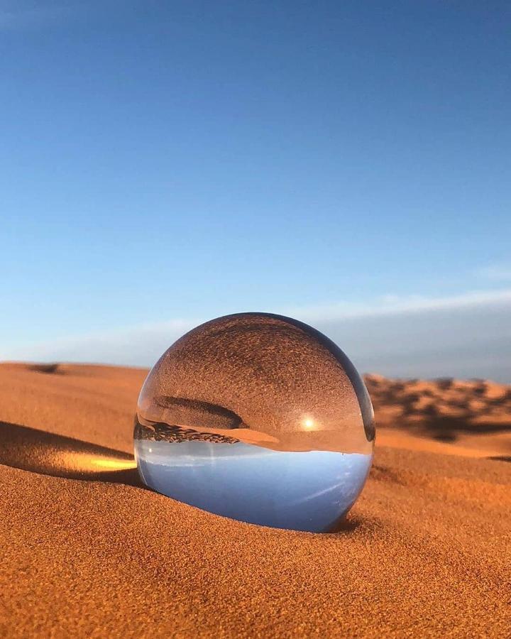 Sahara Majestic Luxury Camp Hotel Merzouga Exterior photo A lensball in the desert