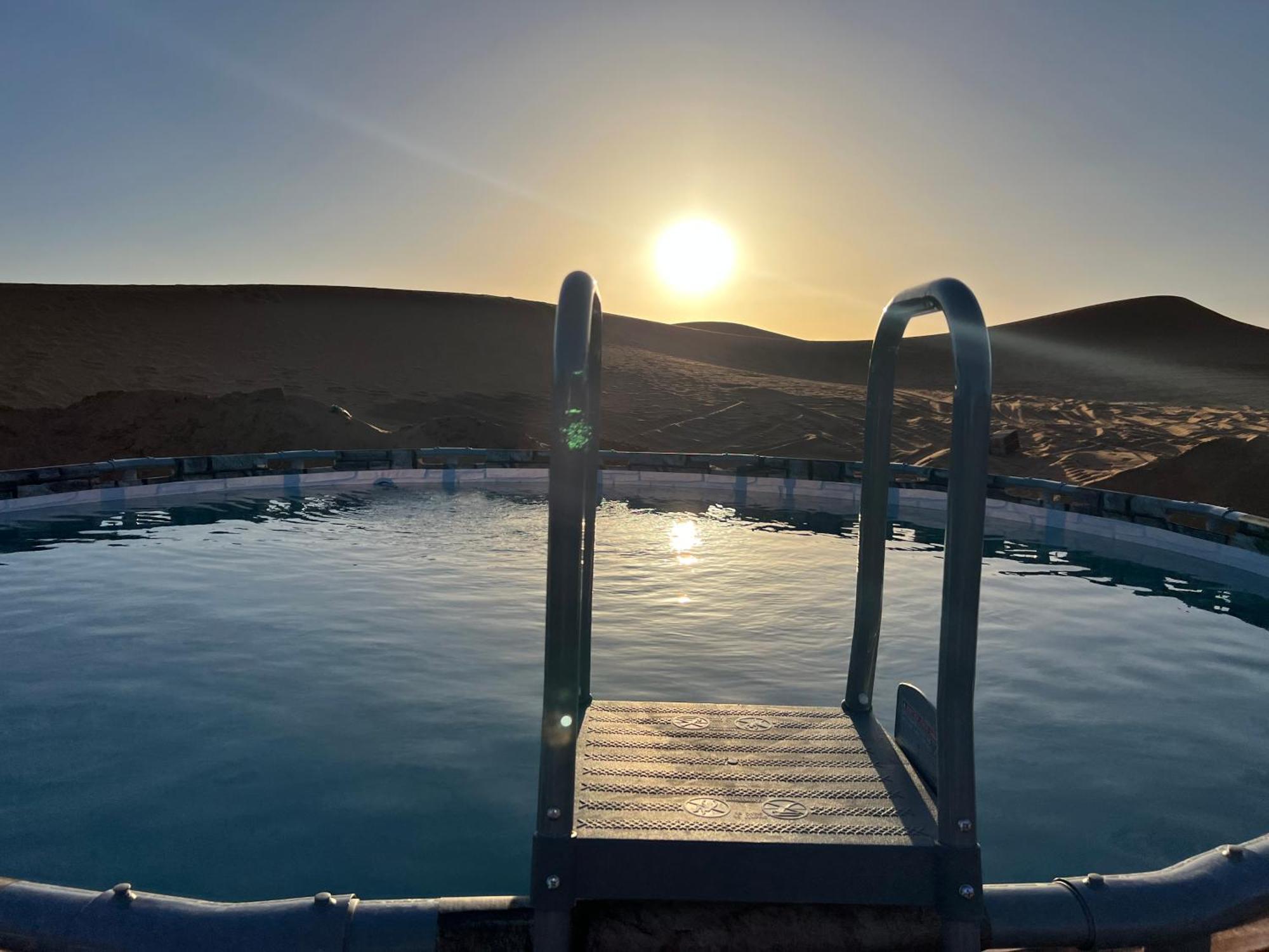 Sahara Majestic Luxury Camp Hotel Merzouga Exterior photo Sunset at the Blue Lagoon