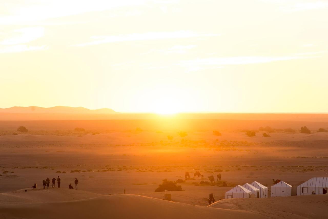 Sahara Majestic Luxury Camp Hotel Merzouga Exterior photo Sunset over the Sahara Desert